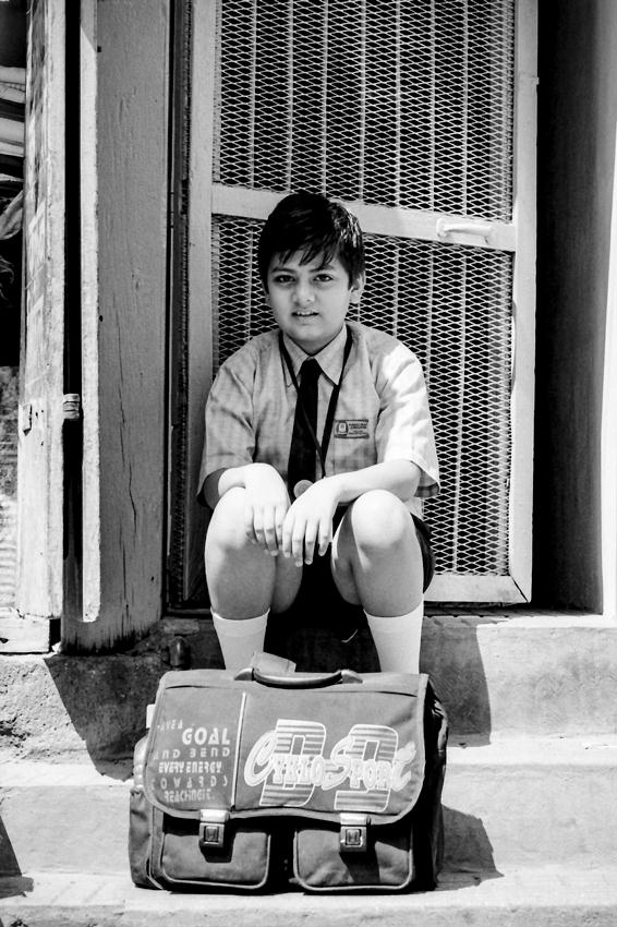School boy sitting