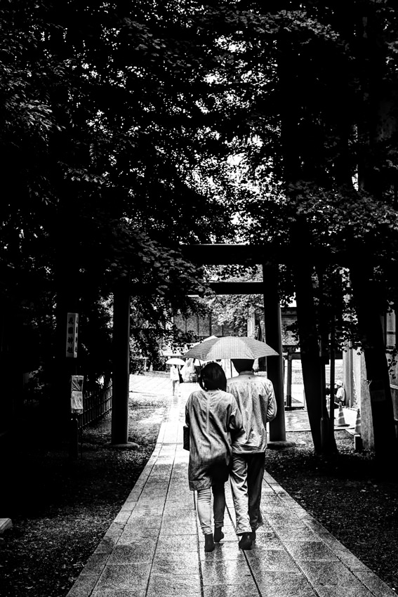 Couple under same umbrella