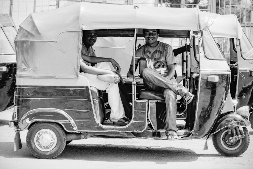 Men chatting on auto rickshaw