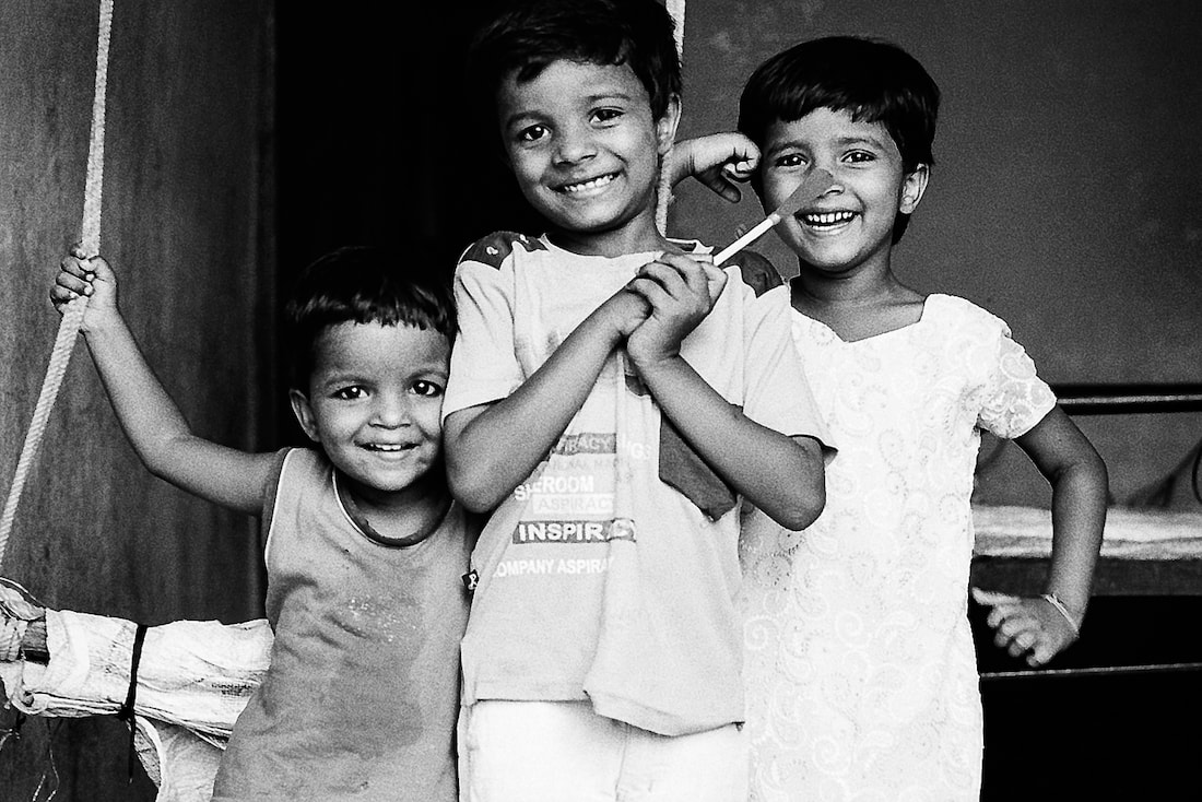 Three kids smiling