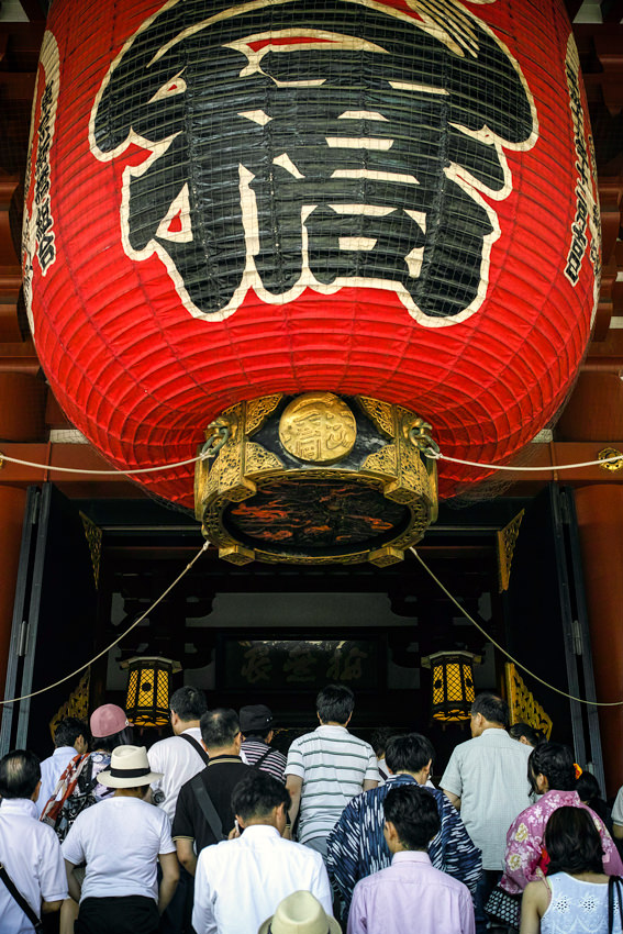 worshipers under big lantern
