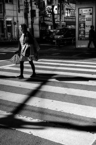 Woman walking pedestrian crossing