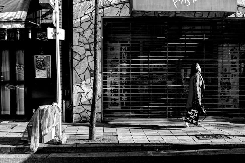 Woman walking with bag