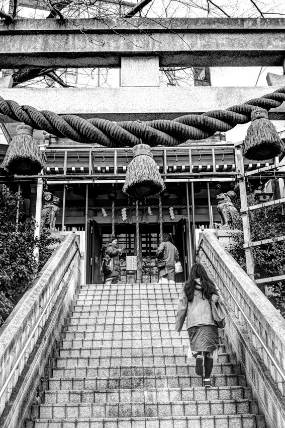 Woman entering Shinto shrine