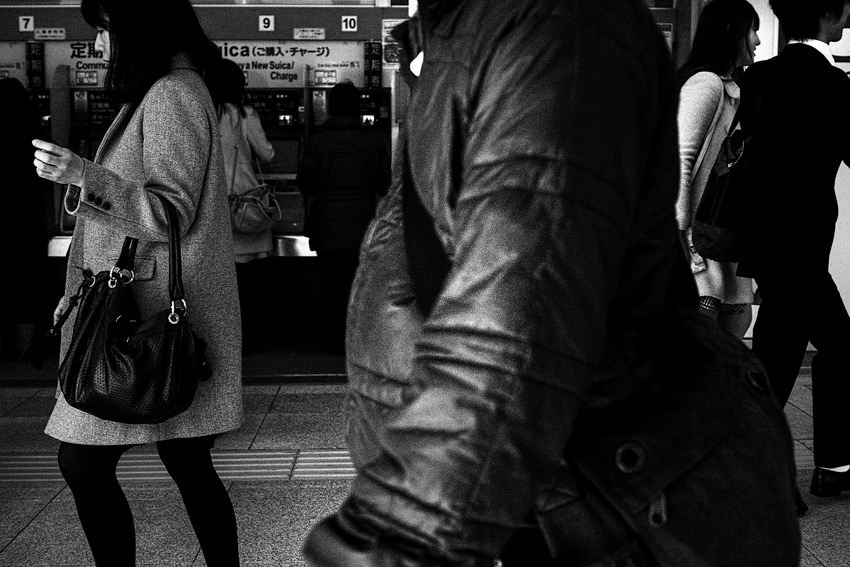 Pedestrians in front of station