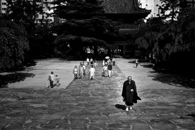 Buddhist monk walking precinct