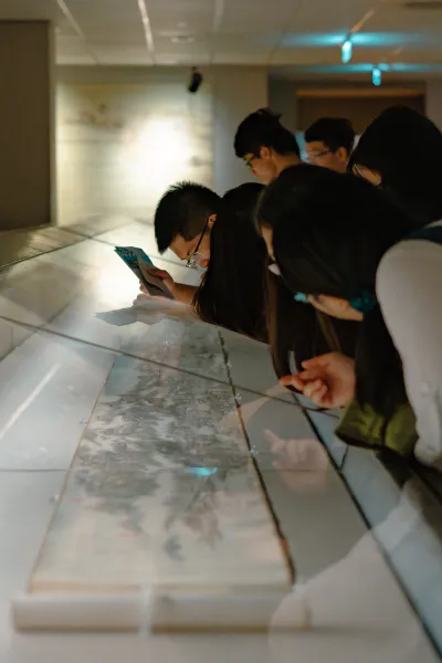People watching scroll in National Palace Museum