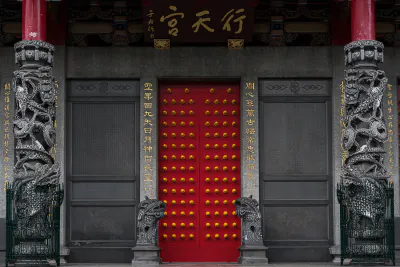 Red door and yellow rivets of Hsing Tian Kong