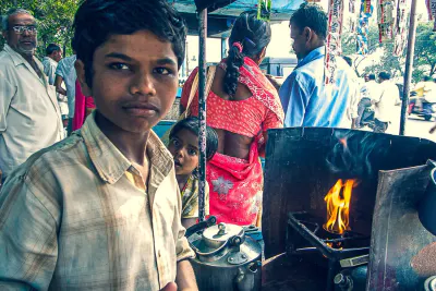 Boy working in Chai stand and his little sister