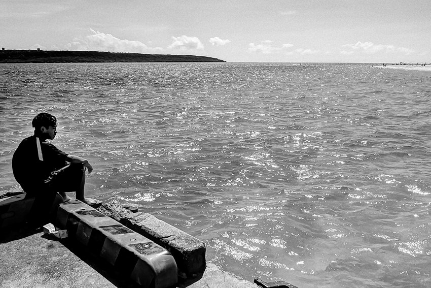 Boy watching ocean