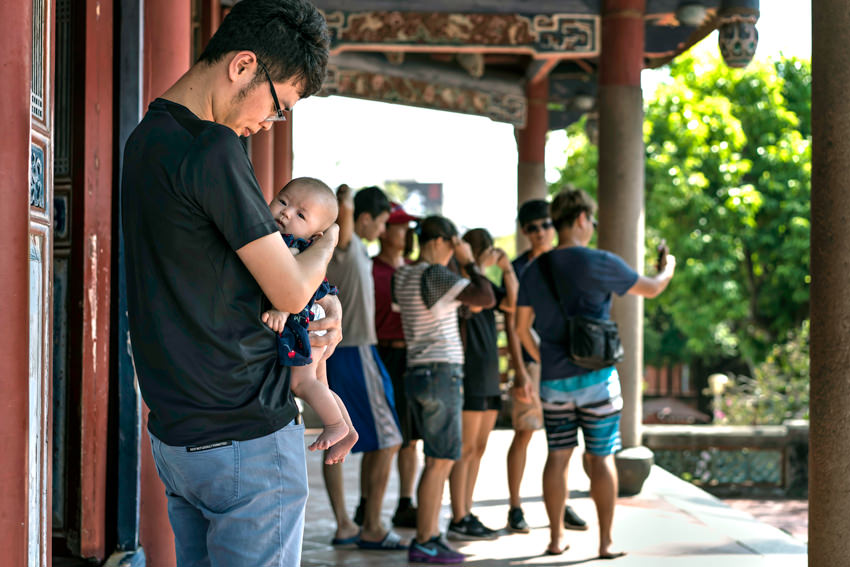 young father holding his baby