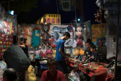 Shooting game in night market