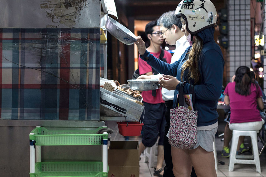 Woman coming to food stall