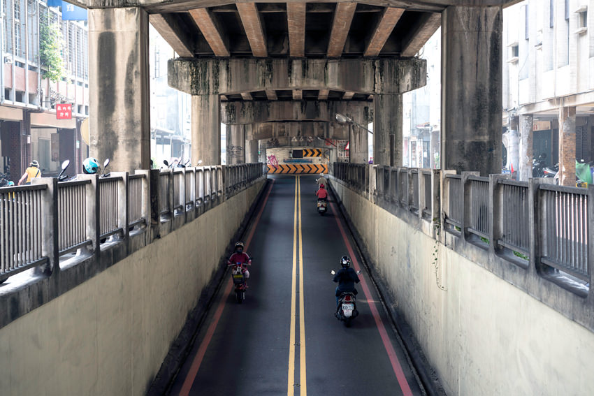street under bridge over railway