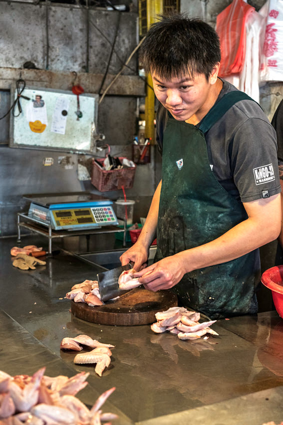 Young man cutting wing tips