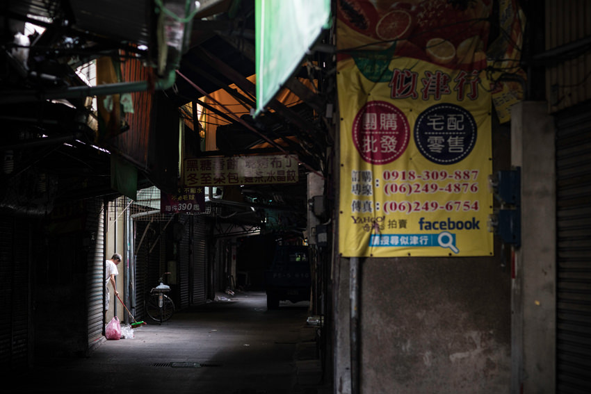 Dim passage in market