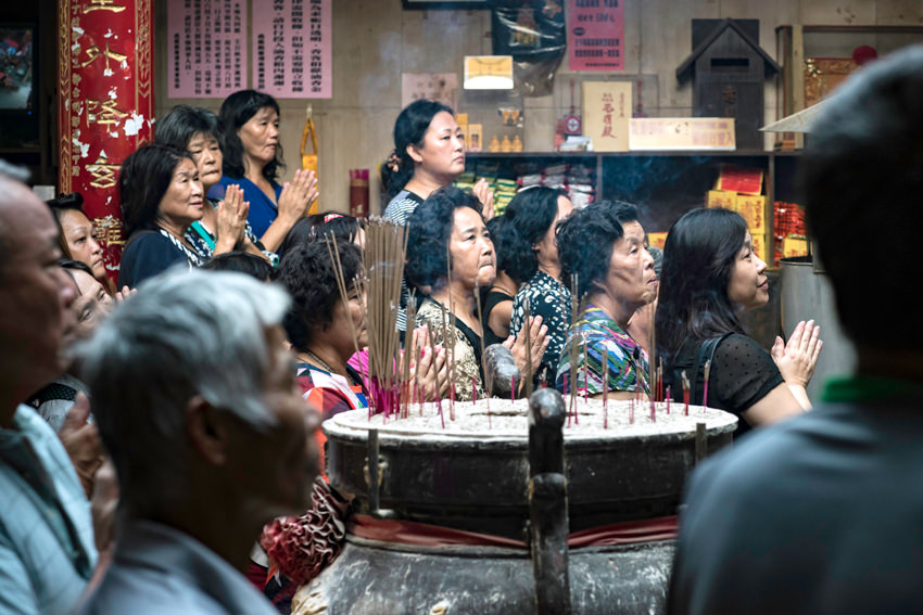 People around incense burner