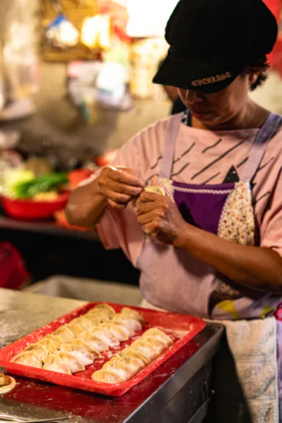 Woman making dumplings in Yamuliao Market