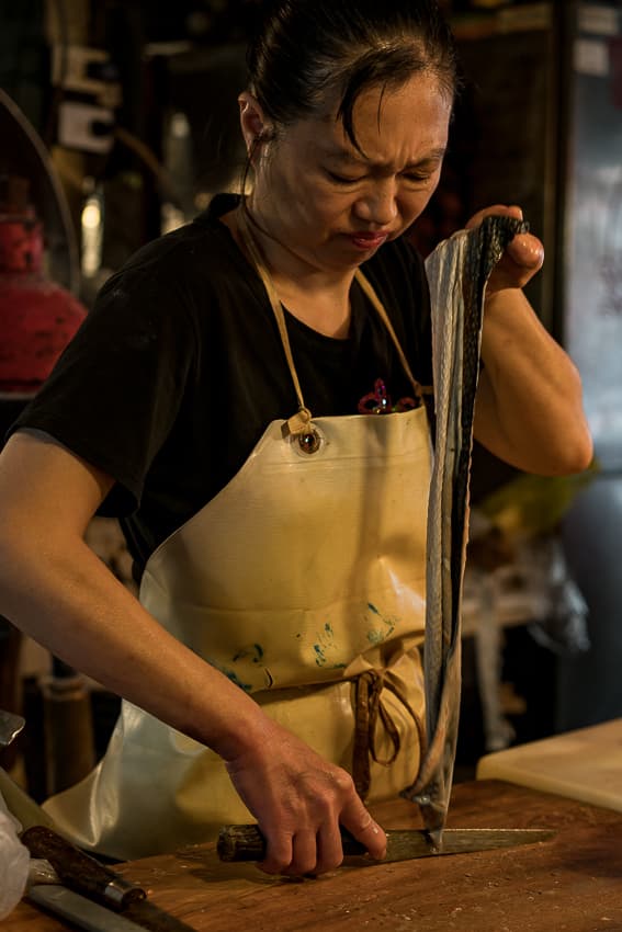 Woman cooking eel