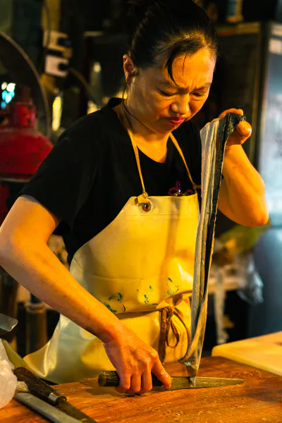 Woman cooking eel