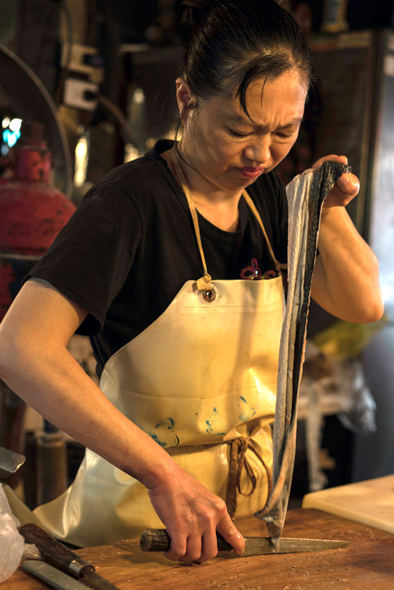 Woman cooking eel