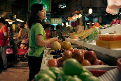 Smiling woman in fruit store