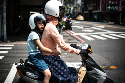 Parent and child on same motorbike