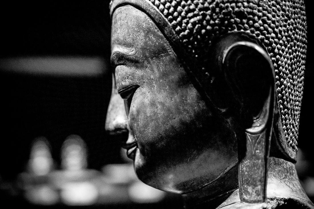 Profile of a Buddha statue with long earlobes