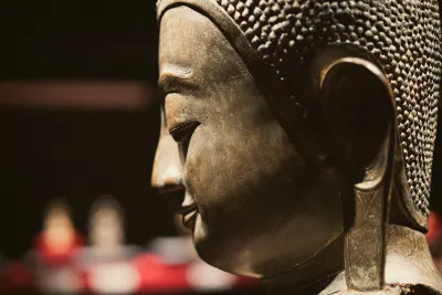 Profile of a Buddha statue with long earlobes