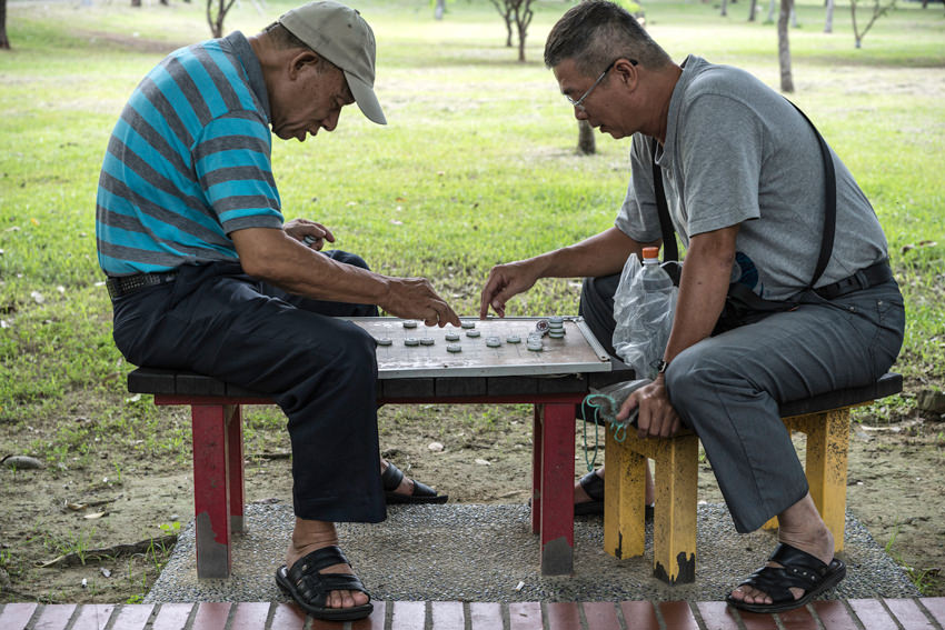 men playing Chinese chess