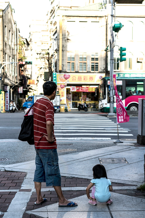 Father and daughter waiting at stoplights