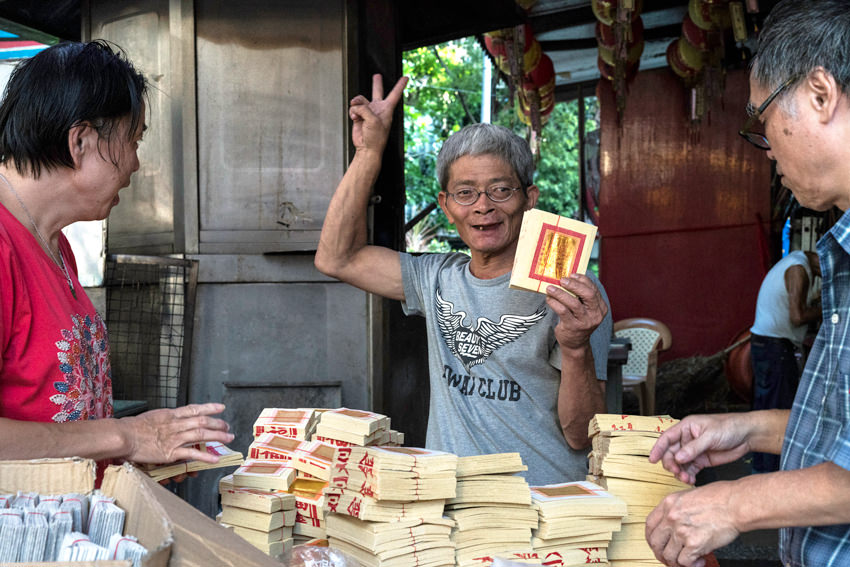 Heap of joss paper and peace sign