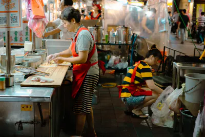 woman cooking in food stall