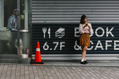 Girl standing in front of shutter