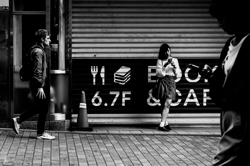 Girl standing in front of shutter