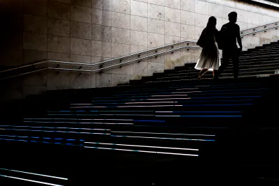 Silhouette of couple climbing stairs