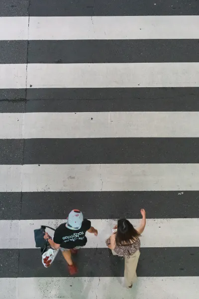 Two persons crossing