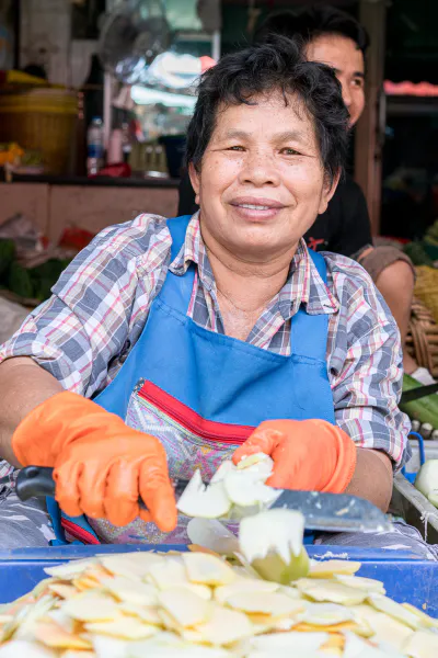 Woman cutting fruits