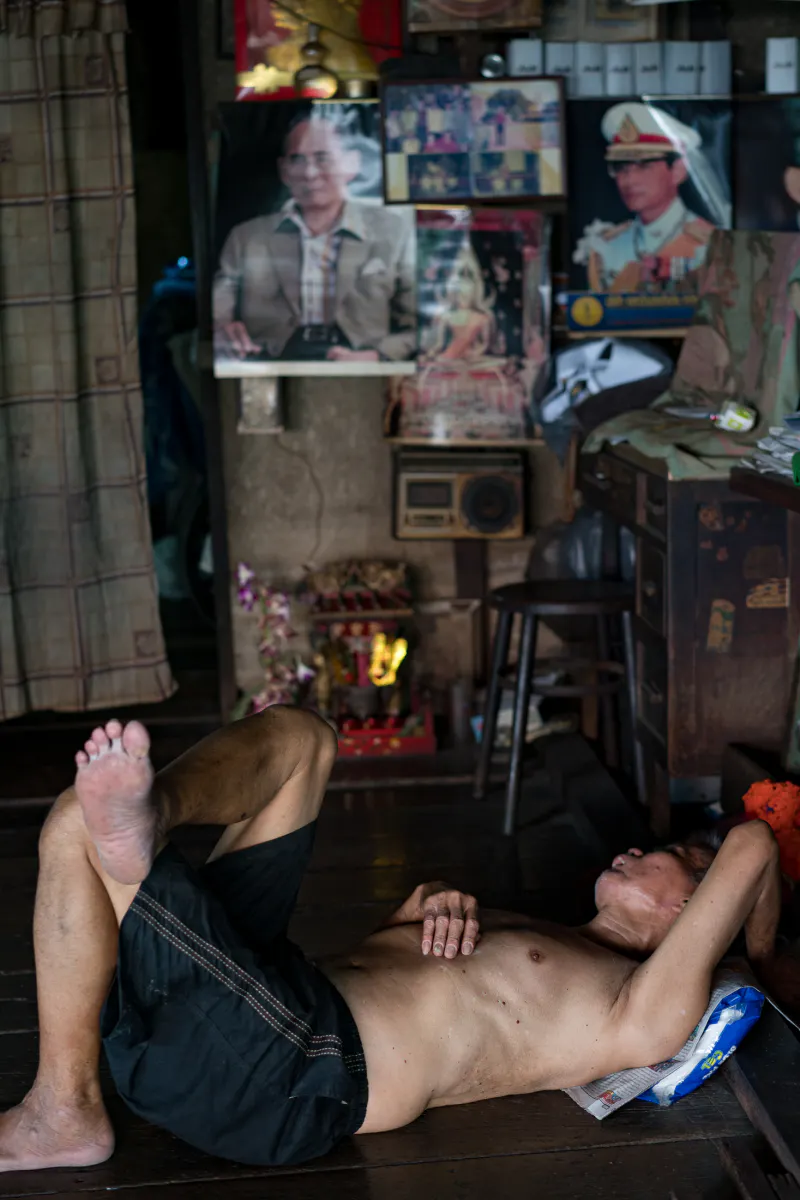 Man sleeping on wooden floor