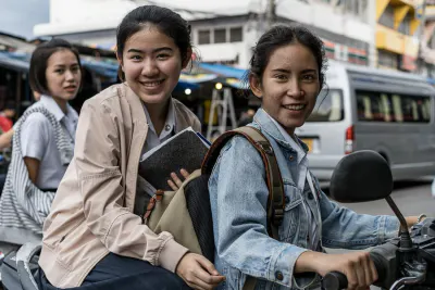 Three school girls in Mae Klong