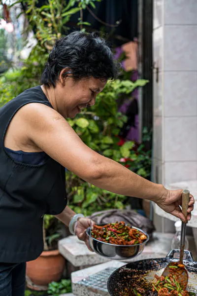 Woman scooping cuisine