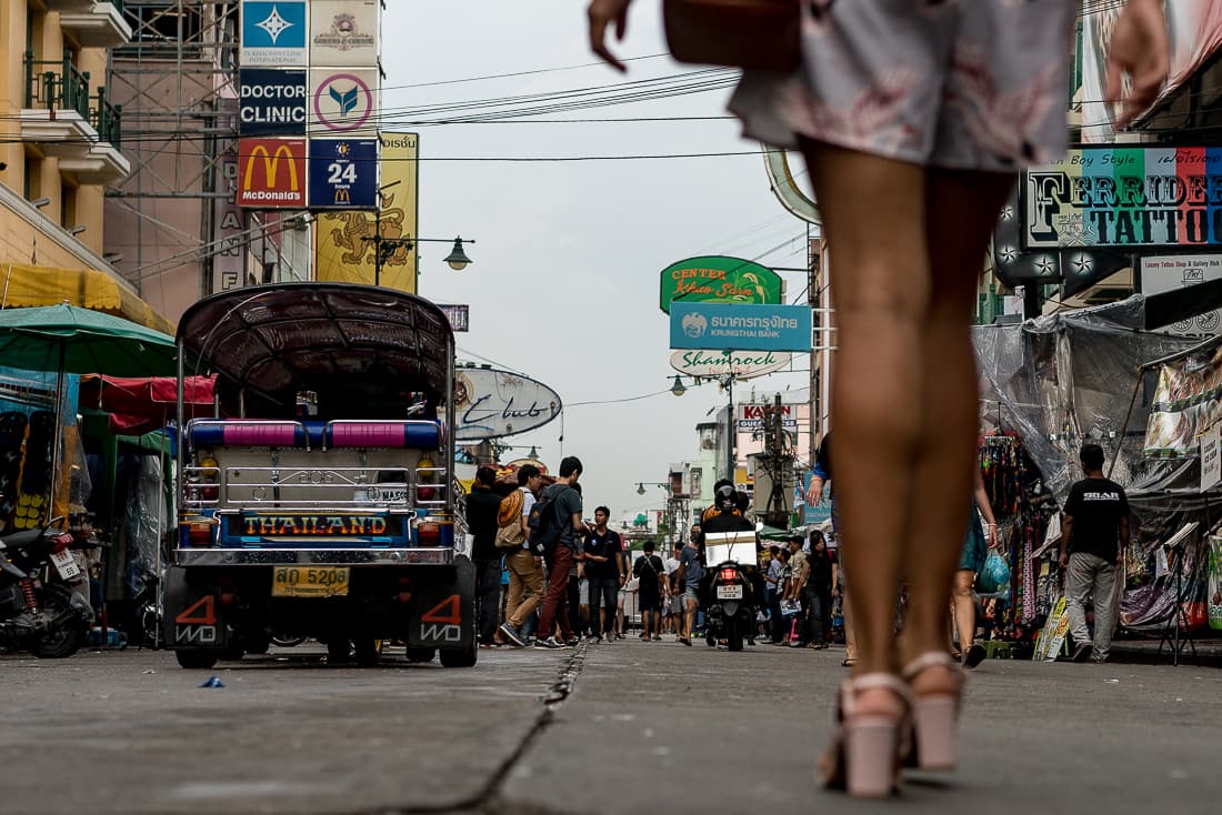 Slender legs walking through Khaosan Road