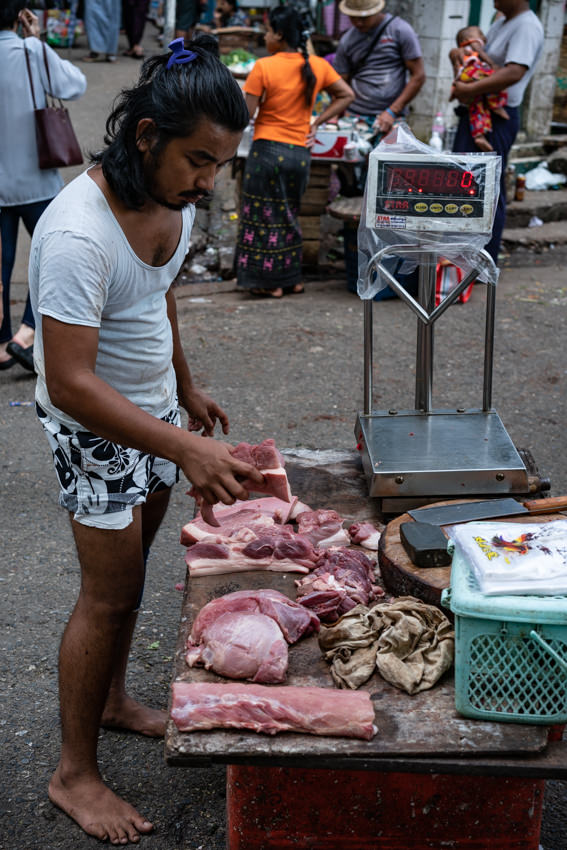 Man selling blocks of meat