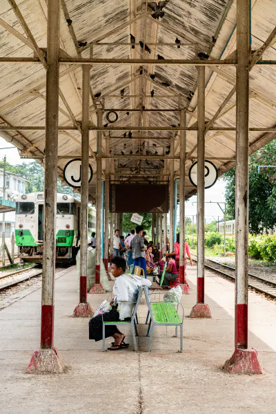 Man resting on platform of Insein station