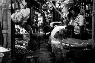 Man standing in his dim store