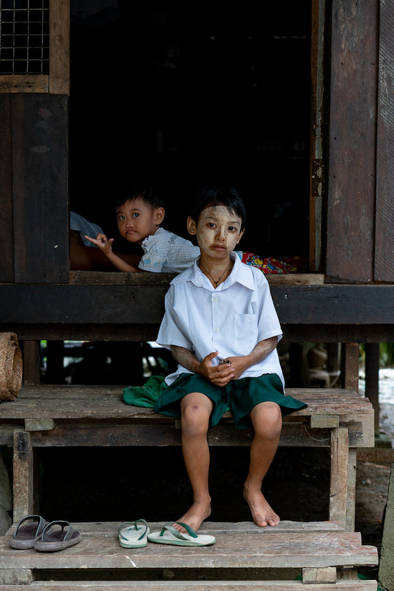 Boys relaxing in high-floored house