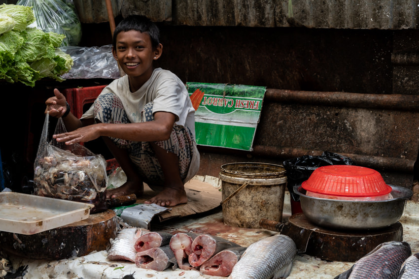Boy selling fishesl