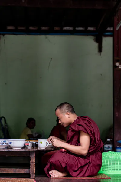Buddhist monk having breakfast