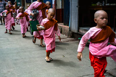 Little nuns walking sidewalk