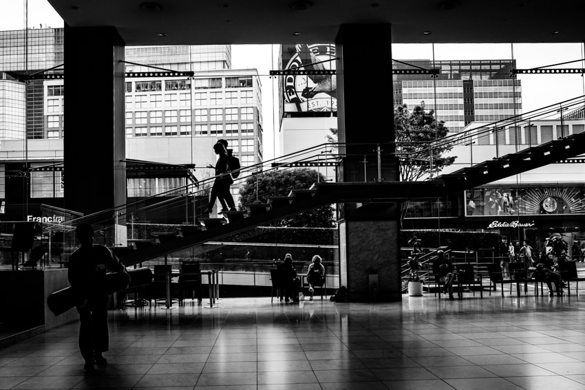 Silhoutted couple descending stairway together
